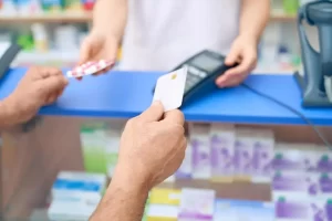customer-paying-pills-using-credit-card